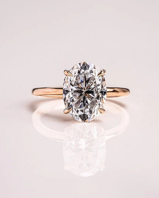 hidden halo oval moissanite engagement ring