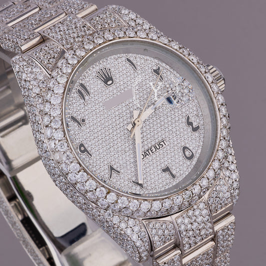 Luxury watch with diamond-studded case on a gray background