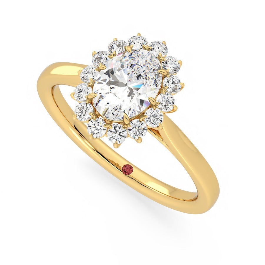 Oval diamond centre and floral diamond halo engagement ring set in 18ct yellow gold