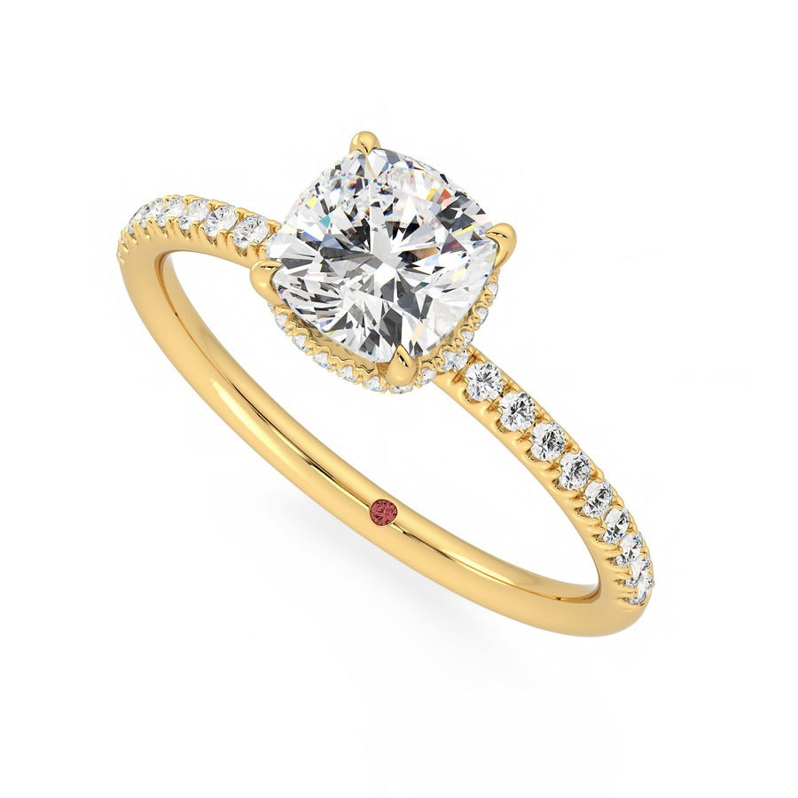 Cushion solitaire engagement ring with hidden diamond halo and pavé band