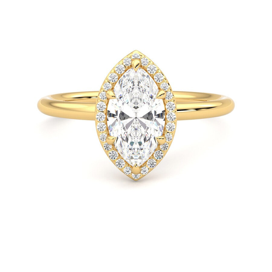 Marquise solitaire with pavé diamond halo engagement ring set in 18ct yellow gold