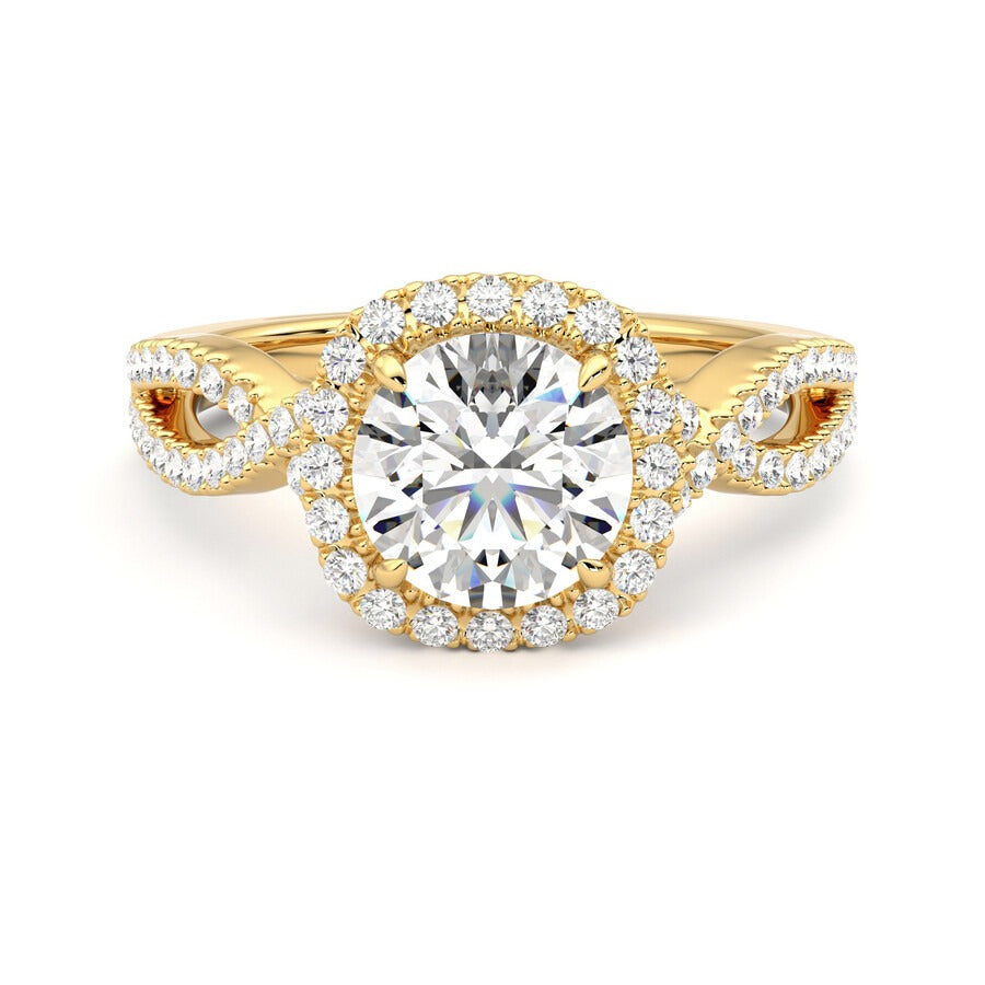 Round centre diamond and pavé diamond halo engagement ring set in 18ct yellow gold