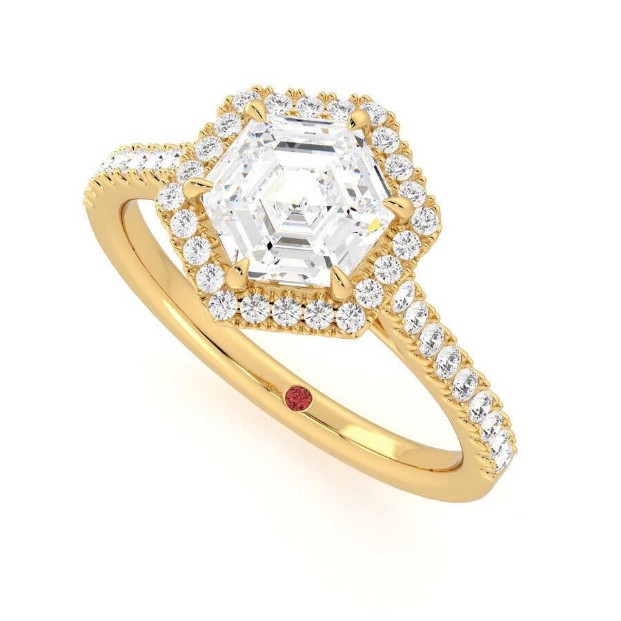 Hexagonal diamond centre and pavé diamond halo engagement ring set in 18ct yellow gold